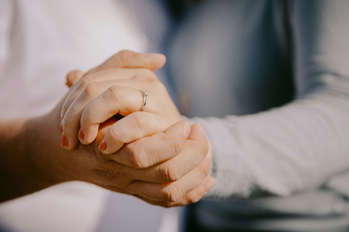 Two people holding hands.